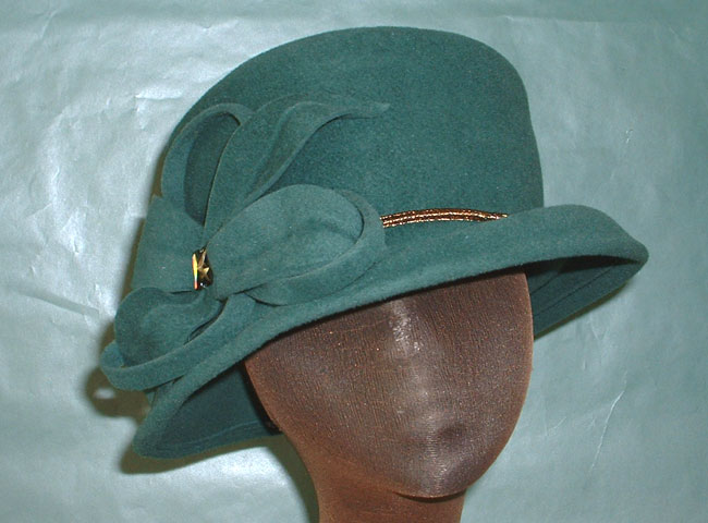 velour in a small but classy hat with a self trim matching flowe
