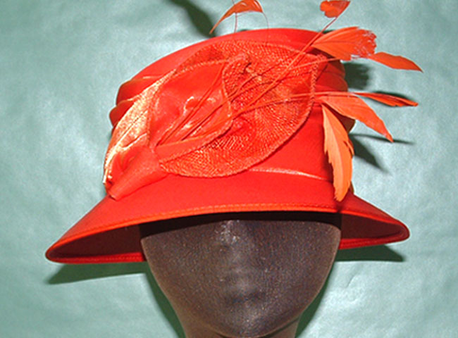 taffeta hat and trimmed with petals and feathers